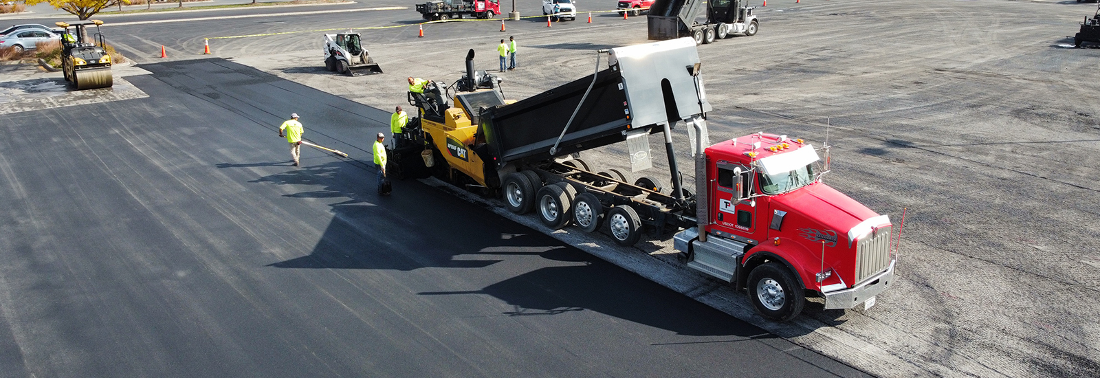 Tibbs crew paving a parking lot