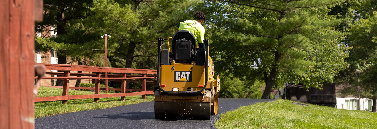 Image of worker on an asphalt roller