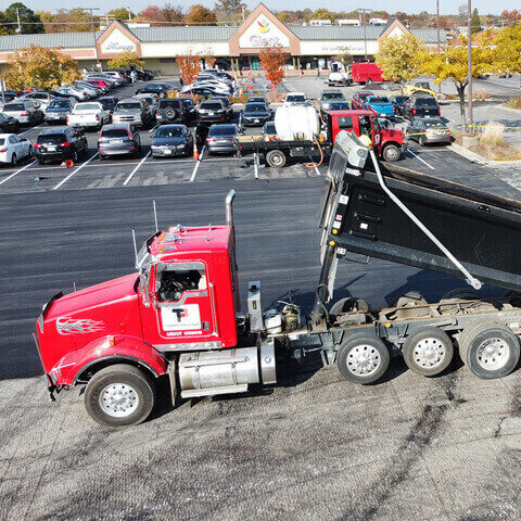 Image of Tibbs dump truck in a parking lot 